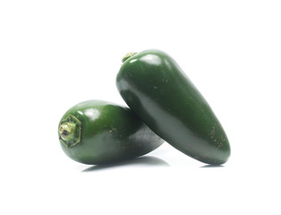 green chilies on white background (jalapeno)