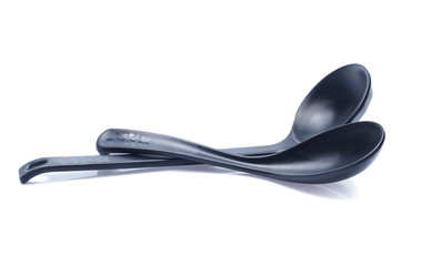 plastic black spoon, isolated on white background