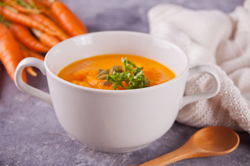 Healthy eating carrot cream soup. Vegetarian vegetables soup.