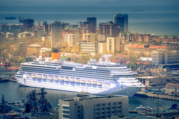 Aerial view of the city landscape with a beautiful white liner.