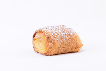 A tasty fresh puff pastry with powdered sugar sprinkled on top