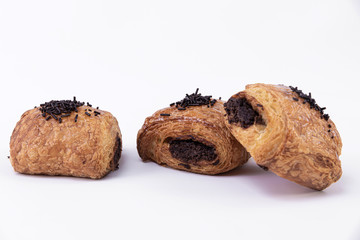 Three tasty puff pastry rolls filled with freshly baked chocolate