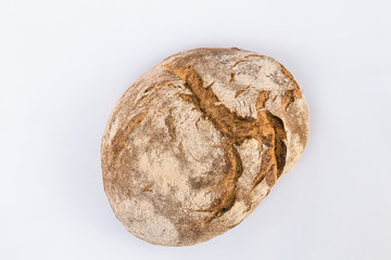 Loaf of rye bread isolated on white. Top view