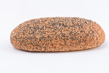 Fresh bread with sunflower seeds, sesame seeds and chia on white background