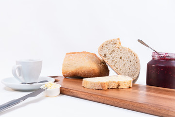Simple breakfast, Toast and butter, loaf of bread on white background