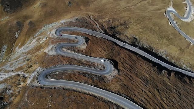 Cars driving on transalpina road 