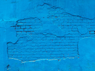 Obraz premium The texture of the brick wall of many rows of bricks painted in blue color. Concepts: wall, blue, bricks