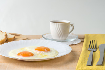 Fried eggs on rustic background