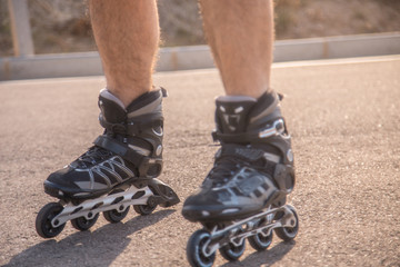 man with inline skates skating on the street
