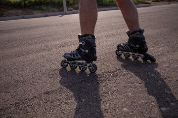 man with inline skates skating on the street