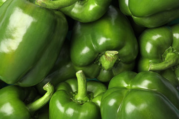 Obraz na płótnie Canvas Ripe green bell peppers as background, top view