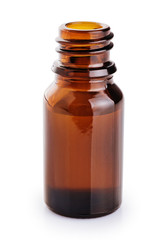 Bottle with essential oil isolated on white background.