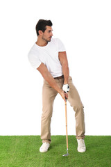 Fototapeta premium Young man playing golf on white background