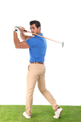 Fototapeta na wymiar Young man playing golf on white background
