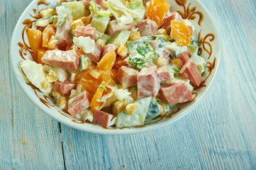 Cabbage salad with ham, cucumber and corn