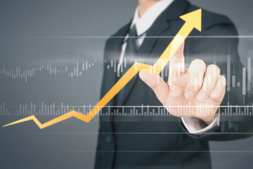 Businessman  Touching stock Graph Indicating Growth