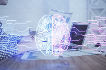 Man typing on keyboard background with brain hologram. Concept of big Data. Double exposure.