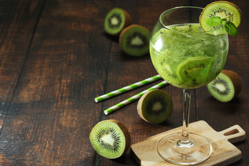 A glass with kiwi cocktail