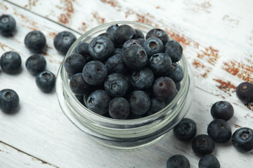 A glass bowl with blueberry