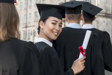 Portrait of group of students celebrating their graduation