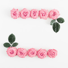 Fototapeta na wymiar Beautiful flowers composition. Frame made of pink rose flowers on white background. Valentines Day, Easter, Birthday, Happy Women's Day, Mother's day. Flat lay, top view, copy space, banner