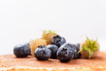 Fresh blueberry and raspberry on pancake