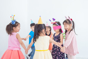 Group of little asian children playing games together in Birthday party