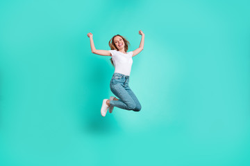 Fototapeta na wymiar Full size photo of cute excited person raising fists screaming shouting yeah isolated over teal turquoise background