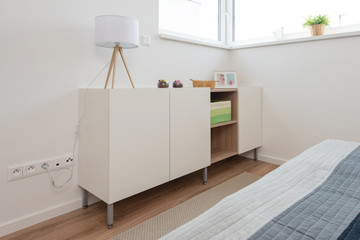 Wooden cabinet in contemporary bedroom