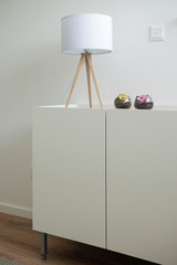 Lamp and vase in bedroom of contemporary house