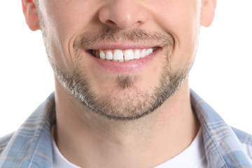 Fototapeta premium Man with healthy teeth on white background, closeup