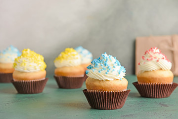 Tasty Birthday cupcakes on table