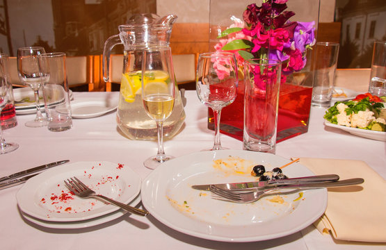 Dirty Dishes On The Table In The Restaurant After Lunch