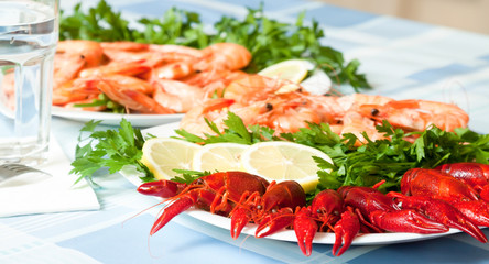 cooked shrimp and crayfish on plate close up