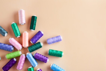 Many sewing threads on color background