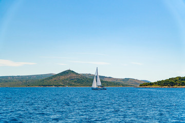 Lonely Yacht sailing on opened sea, Croatia