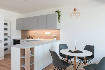 Interior of modern kitchen with dining table