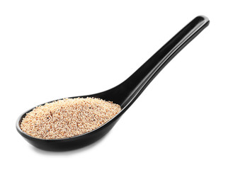 Spoon with poppy seeds on white background