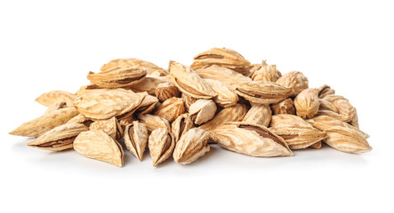 Unpeeled almond nuts on white background