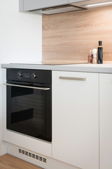 Electric stove with induction cooktop in contemporary kitchen