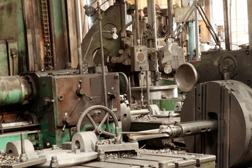 Lathe; Industry; Machinery; Gear; Wheel; Manufacturing Equipment; Factory; Drill; Production Line; Metal Industry; Operating; Manufactured Object; Metalwork; Manufacturing Occupation; Industrial Equip