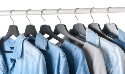 Fototapeta premium Rack with hanging clothes on white background