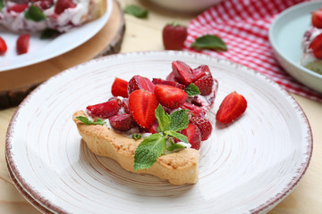 Piece of tasty strawberry cake on plate, closeup