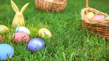 Colorful Easter eggs on grass outdoors