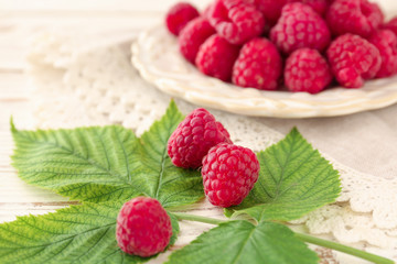 Sweet ripe raspberry on wooden background
