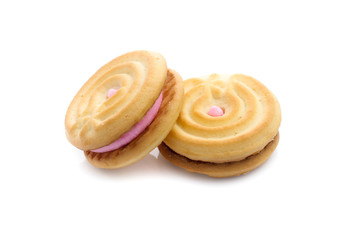 Obraz na płótnie Canvas sandwich cookies with strawberry cream on white background