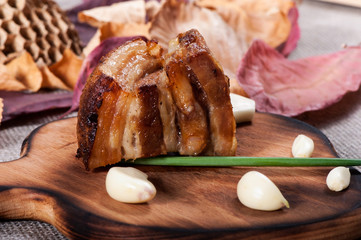 Baked bacon with roasted garlic and spices. Ukrainian national food.