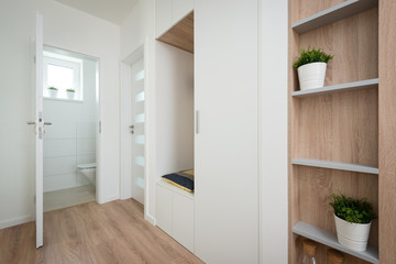 Hallway next to small bathroom in a contemporary house