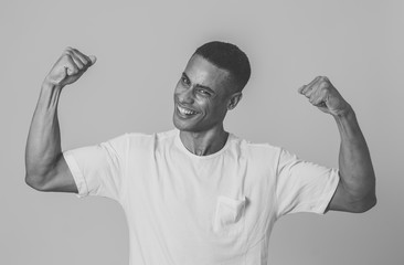 Close up portrait of funny strong smiling and laughing attractive man in happy face and fitness.