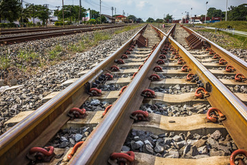 Two railway tracks merge together.
